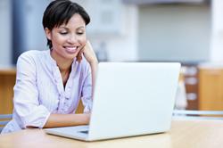 Woman looking at laptop